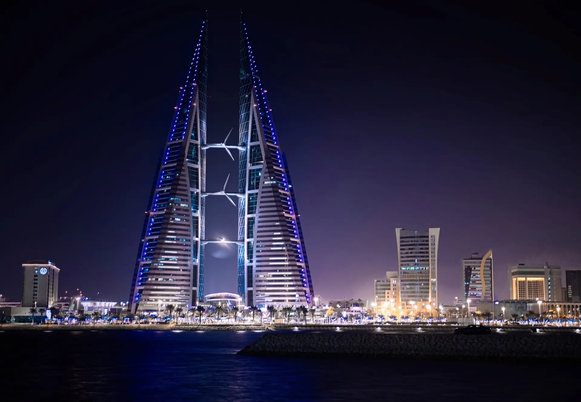 The Bahrain World Trade Center towers lit at night on the Manama waterfront