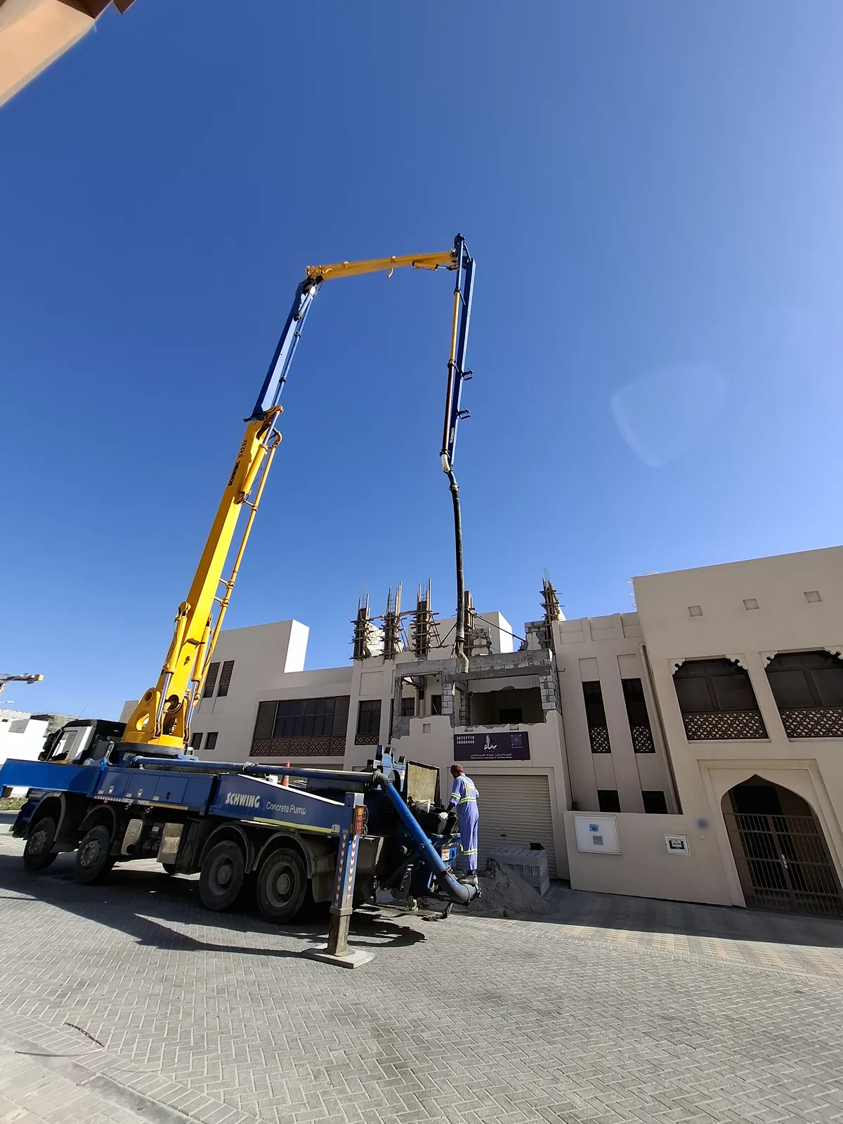 Concrete pump pouring an additional floor on a Benaa Contracting site