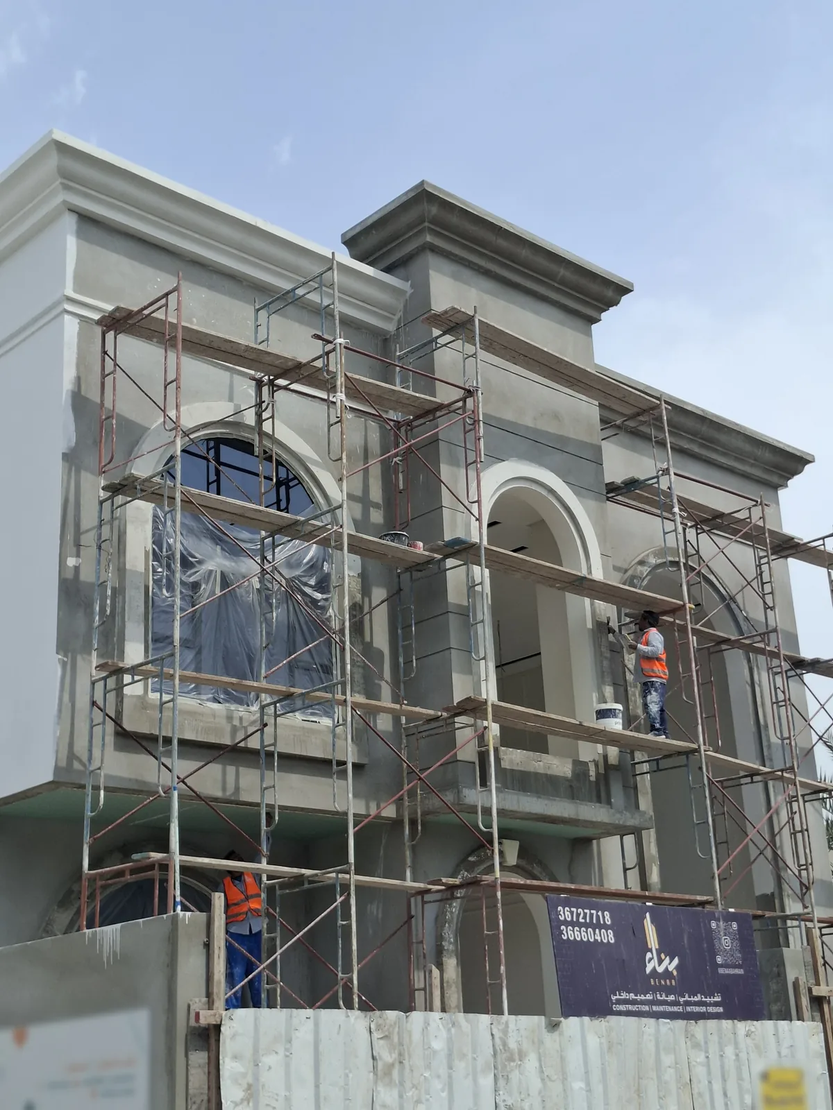 Benaa Contracting painter on scaffolding working on the external elevation of a private villa